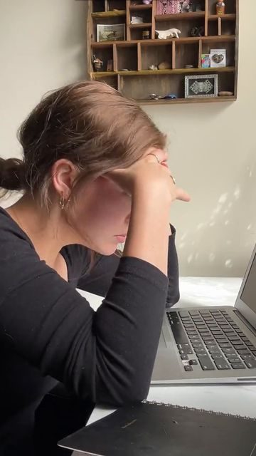 Creator 1, head in hands at laptop